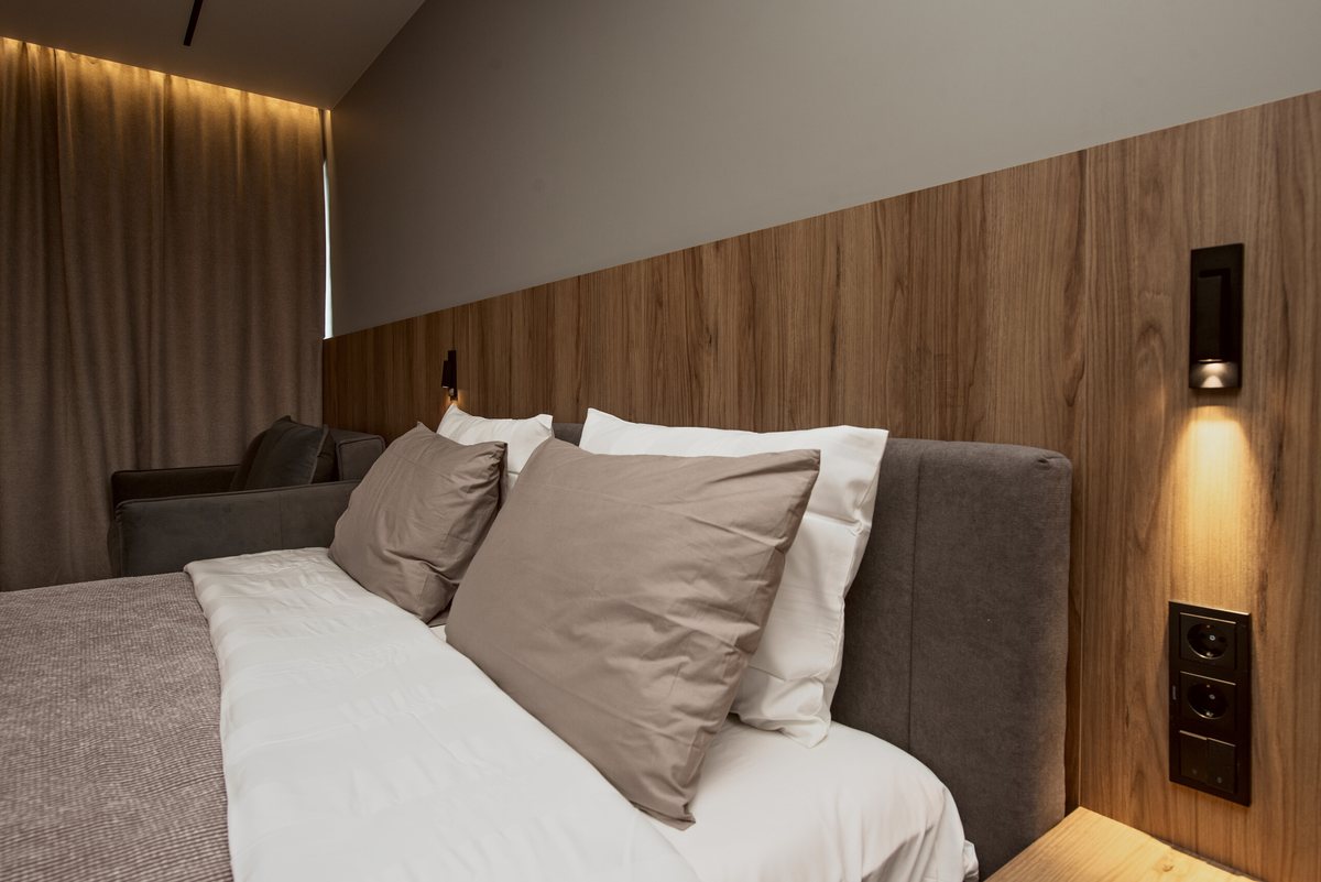 King bed with reading lights and blackout curtains